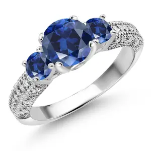 Gem Stone King 925 Sterling Silver Blue Created Sapphire and White Moissanite Engagement Ring For Women (2.18 Cttw, Round 7MM and 4MM)