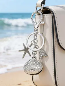 A sparkling starfish shell alloy keychain studded with diamond letters A-Z, a stylish summer ocean-style keychain pendant, Y2K style cute charm, suitable for car keys, backpacks, earphones, and bags