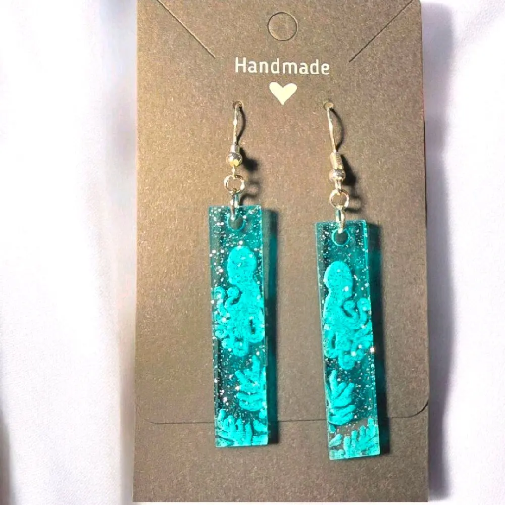 22) Transparent Glittery Blue Octopus Earrings