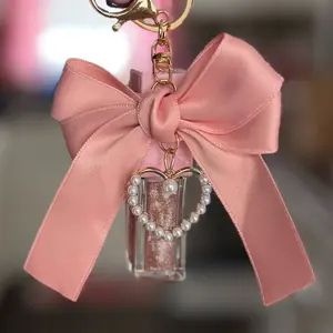 Bow Babe Keychain with Lip Oil - Pink Satin Bow & Pearl Heart Charm - Perfect for Bags & Keys