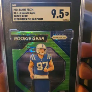 comees with 10 rookie cards from different panini products Panini 2024 Prizm RG-LLU Laiatu Latu Rookie Gear Neon Green Pulsar Prizm Card 9.5 MT-5539910Panini 2024 Prizm RG-LLU Laiatu Latu Rookie Gear Neon Green Pulsar Prizm Card 9.5 MT-5539910