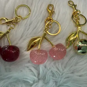 Cherry Keychain Red Light Pink and Gold Sparkly Design with Gold Bell and Leaf Charm