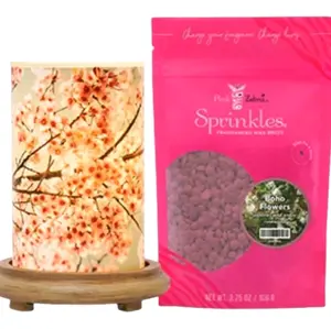 Pink Zebra Sakura Simmer light with wood base.