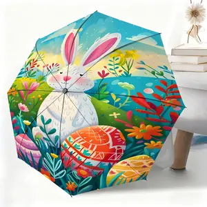 A waterproof folding umbrella featuring a white rabbit amidst colorful flowers; suitable for both men and women, portable and ideal for travel and everyday use.