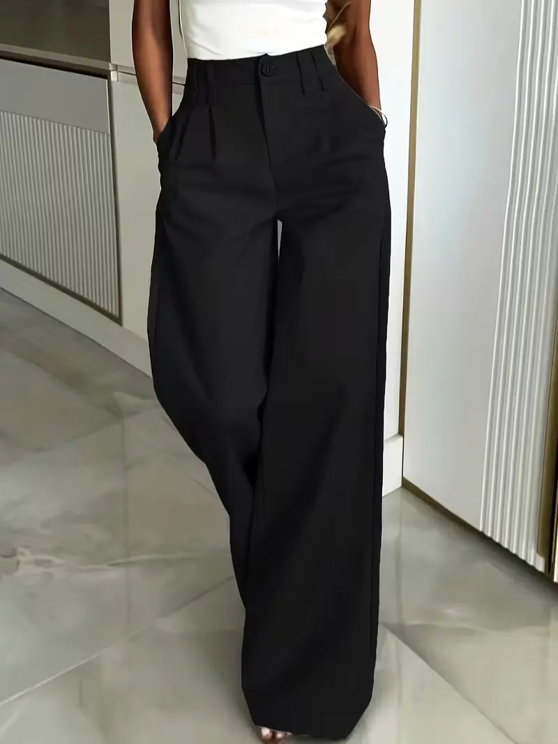 High-end, tailored wide-leg trousers featuring a high waist and a beautiful drape—a versatile staple for the urban commute.