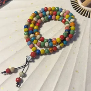 Colorful Jingdezhen ceramic beaded bracelet crafted entirely by hand using kiln-fired glaze techniques—“One color enters the kiln, ten thousand colors emerge”—an exquisite piece of jewelry deeply rooted in Chinese style.