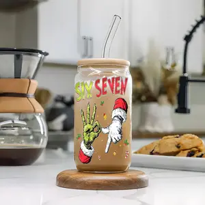 Trendy Christmas Grinch 67 Meme 16oz Glass Can Cup with Lid and Straw, Reusable Glass Drinking Cup, High-Quality Glass Jar for Iced Coffee, Hot Chocolate, Holly & Candy Cane Design Festive Glassware, Perfect Gift for Christmas Lovers