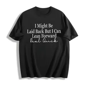 Unisex Crew Neck T-shirt, with Bold Cursive Prints Of White Text On The Front: "I Might, " "Leisurely But I Can, " "Lean Forward Quickly, " And "Really Fast." Fashionable And Casual T-shirt Against A Light Wood Grain Background.
