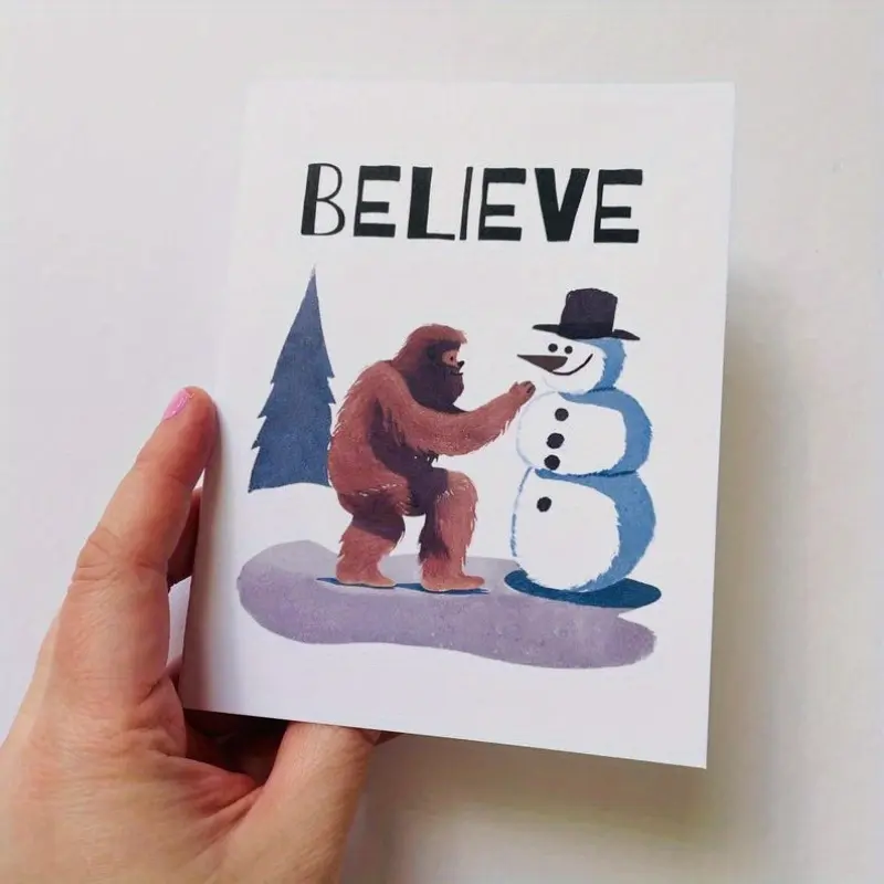 1pc Bigfoot building a snowman Christmas card “Believe”, Bigfoot holiday card, Sasquatch Christmas card, Sasquatch Christmas gift, Bigfoot gift