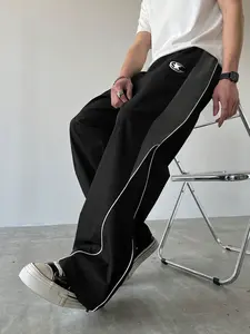 Men’s black athletic pants with paneling, white side stripes and embroidery, casual gym wear, loose sports long pants, trendy street fashion joggers, elastic waistband, straight-leg cut, polyester—men’s pants, Mother’s Day gift