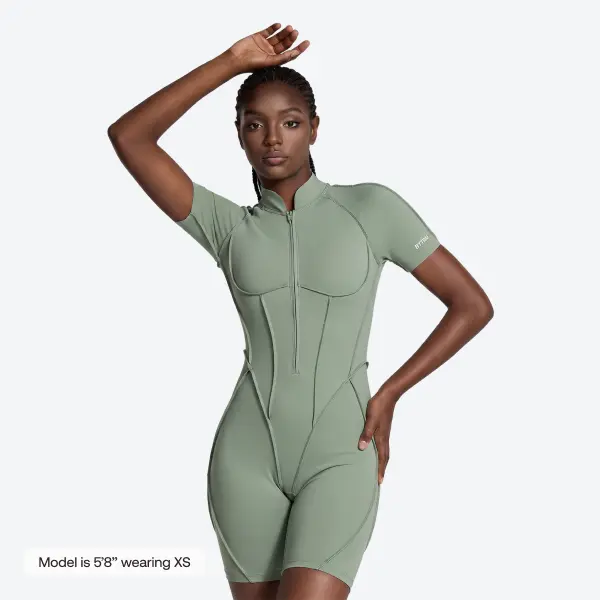 BetterMe Women's Sleek Shorts Catsuit in Sage Green - Smooth Polyester Blend Open Back Jumpsuit for Workout Wear, Sports, Athletic, True-To-Size, Body-Hug Fit, 23% Spandex, 77% Polyester, Body-Hugger
