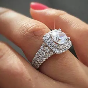 A fashionable, double-layered, four-prong silver-plated ring with Cubic Zirconia stones for women, perfect for everyday wear and as a gift for friends or loved ones.