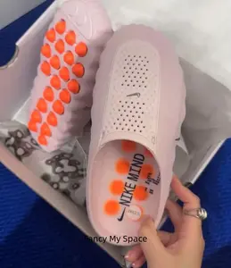 Cute pastel pink chunky clogs with hollow vented upper, dotted orange massage insole relieves foot soreness after long walks, ideal summer women’s daily footwear