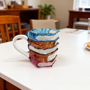 A creative, hand-painted ceramic "book" mug—a coffee cup with a truly unique design. and is undoubtedly an ideal choice when you are looking to select a truly special present. Reusable.