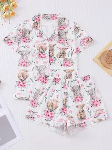 Elegant two-piece women's pajama set with cow print, knitted fabric, short sleeved button top, matching shorts, pajama set, collar and pocket details, suitable for women's pajama set