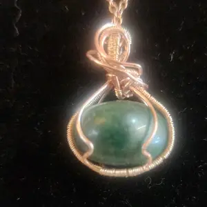 hand made wire wrapped tumbled green stone