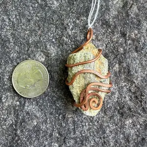 Handcrafted Copper Wire Wrapped Stone Pendant with Unique Design and Natural Texture