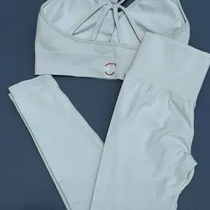 FlexSculpt Strappy Support Set Top & Leggings for Enhanced Comfort and Style with Unique Strappy Design and Comprehensive Support