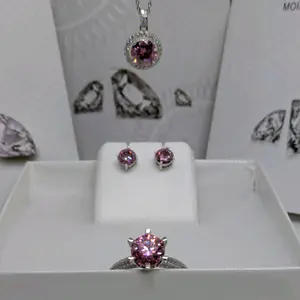 Women's Brand New Beautiful Real Pink Moissanite set in 925 Sterling Silver (Stamped) 3 piece Jewelry Set. 7 Ctw In Total. Bundle Deal. Passes Diamond tester. Comes with GRA certificates. 3Ctw necklace, 3Ctw Resizablesize size 9 ring & 1Ctw earrings.