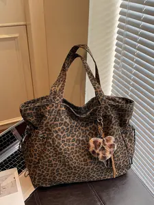 Retro-themed leopard print tote bag, a casual and minimalist fashion staple with a spacious single-shoulder design featuring side pockets and drawstring detailing, perfect for daily commutes, shopping, and social gatherings, Casual Trendy Bag