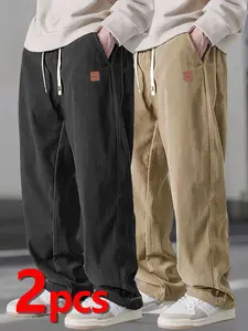 Two men's autumn casual pants featuring a simple and versatile style with drawstring design, adding a casual feel. The pants have delicate small details, such as stitching accents, making them comfortable and stylish. The loose fit provides comfort and fr