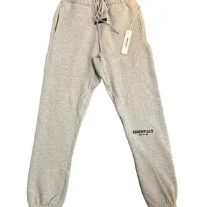 Essentials Essential Dark Oatmeal Pants with Drawstring Waist and Brand Tag