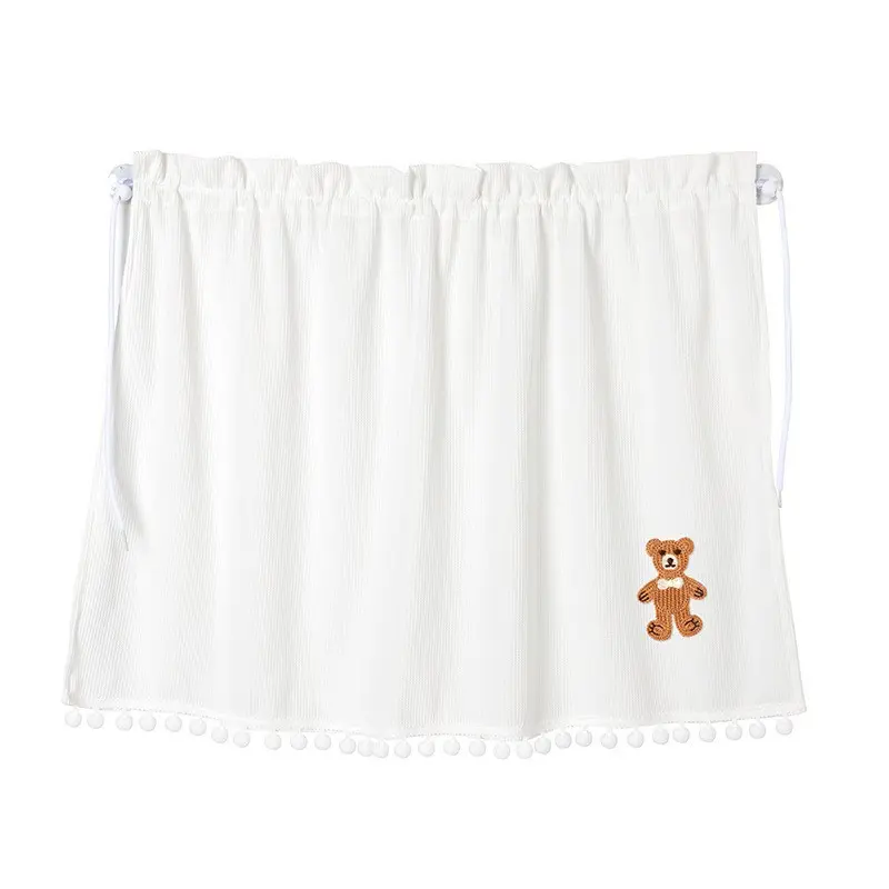 A bow-tied bear curtain