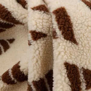 Autumn and winter textured jacquard lamb fleece triangular jacquard full polyester knitted lamb fleece coat fabric