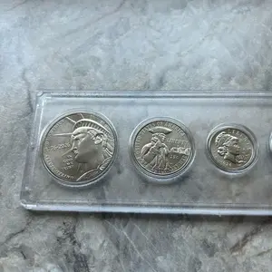 2026 Semiquincentennial 5-Coin Set - BU Half Dollar, Revolutionary War Quarter, Dime, Nickel, and 2025 Penny in Whitman coin holder.