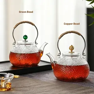700ml hammered glass teapot with copper handle heat-resistant explosion-proof andhigh-temperature-resistant high borosilicate glass home-made tea glass pot for Flower FruitHerbal Tea and Coffee