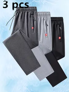 Men’s casual jogger pants, 3-pack — elastic waistband, drawstring and zippered pockets — comfortable polyester-blend fabric, stretchy joggers, lightweight for summer, suitable for spring and autumn outings and casual wear