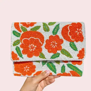 The "Sunset Poppy" Beaded Clutch with Chain - Orange Floral Design on White Background, Beaded Detailing, Magnetic Closure, Versatile Accessory for Evening Events