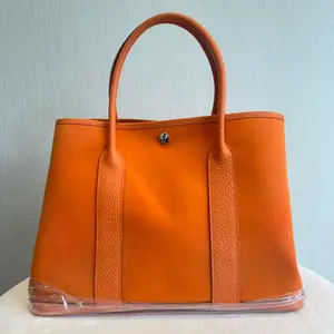 Pre-owned HERMÈS Garden Party Handbag, Size 36, Orange Leather Combination, Silver Buckle