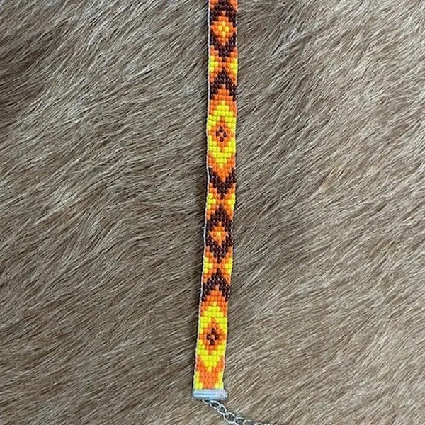 Fall Handmade Peyote Bracelet with Vibrant Orange and Yellow Beads and Unique Tribal Pattern