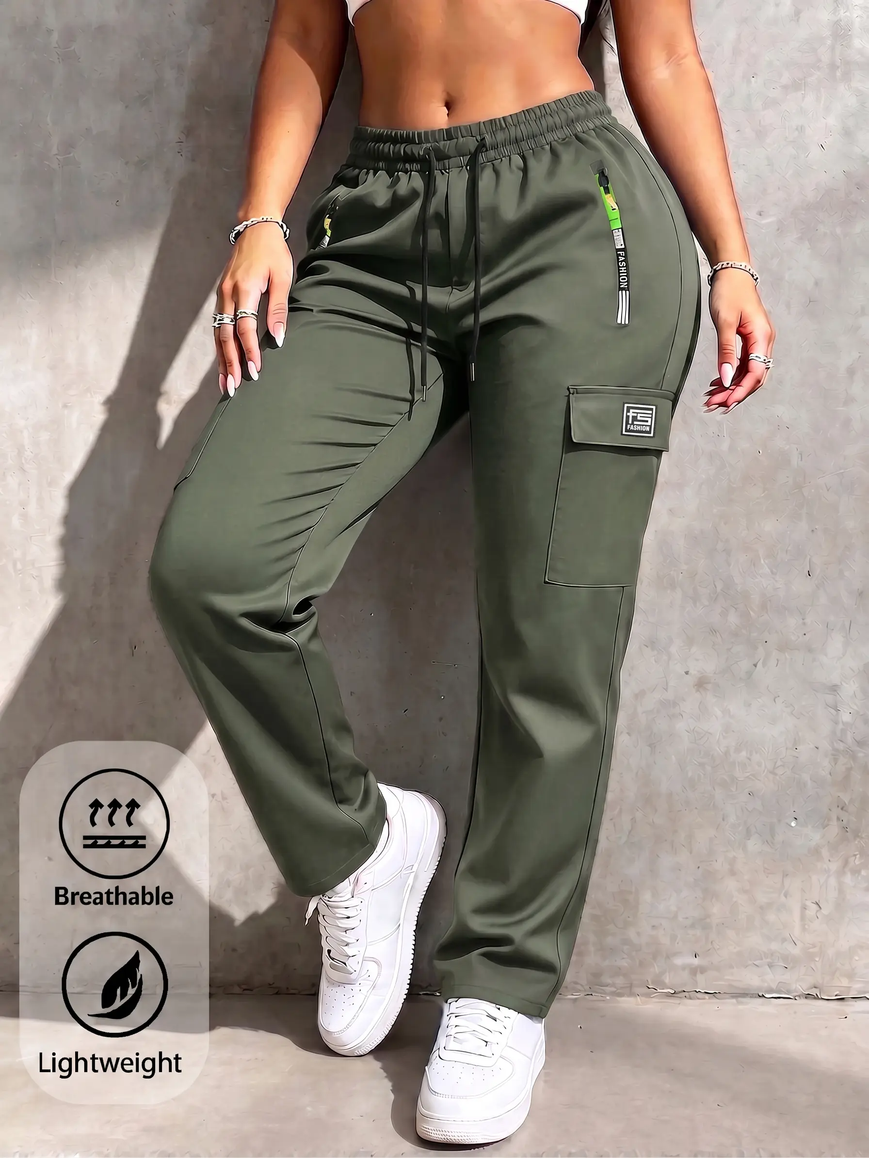 Women’s summer cargo pants with zippered pockets, featuring a stylish large pocket design and an elastic waistband with drawstring; army green long pants for casual outdoor sports and everyday wear, made from stretchy fabric with a straight cut.