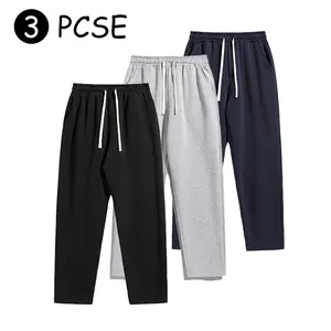 Men’s three-piece set: loose wide-leg drawstring joggers in a casual street-style loungewear design; comfortable running pants for cool weather; suitable for holiday parties at age 20.