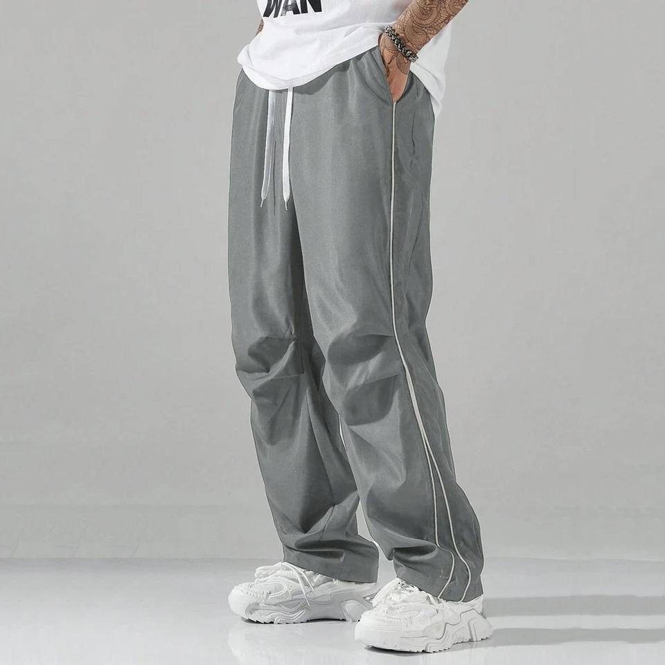Unisex baggy wide-leg sweatpants; men’s casual athletic pants made from soft fabric with an elastic waistband and drawstring; loose fit with side stripes; breathable, lightweight sports fitness streetwear pants; all-day comfort and versatile for everyday