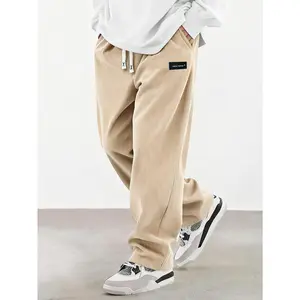 Men's Spring/Autumn Corduroy Casual Long Pants, solid color with drawstring pockets. Lightweight, soft, breathable, and comfortable. Wide-leg straight fit with elastic waist; highly versatile for daily casual outings.