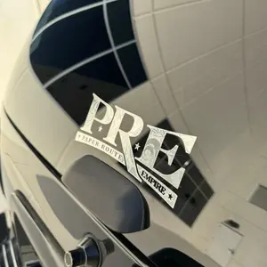 P.R.E engraved logo