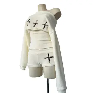 TOP 2025 new cross three-dimensional decorative rivet off-shoulder one-shoulder knitted long-sleeved top shorts for women