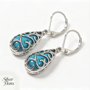 S925 Blue Tear · Vintage cutout vine French-style lever-back earrings, featuring a vintage cutout vine swirl plus blue teardrop stones; suitable for everyday commuting, retro/bohemian outfits, and holiday gifts; styles include vintage, bohemian, and Weste
