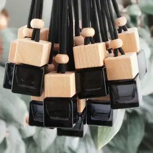 Car diffuser rear view mirror aromatherapy scent car air freshener essential oil bottle diffuser dangle for rooms, car accessories glass and wood bottle dangle pretty design teardrop bottle