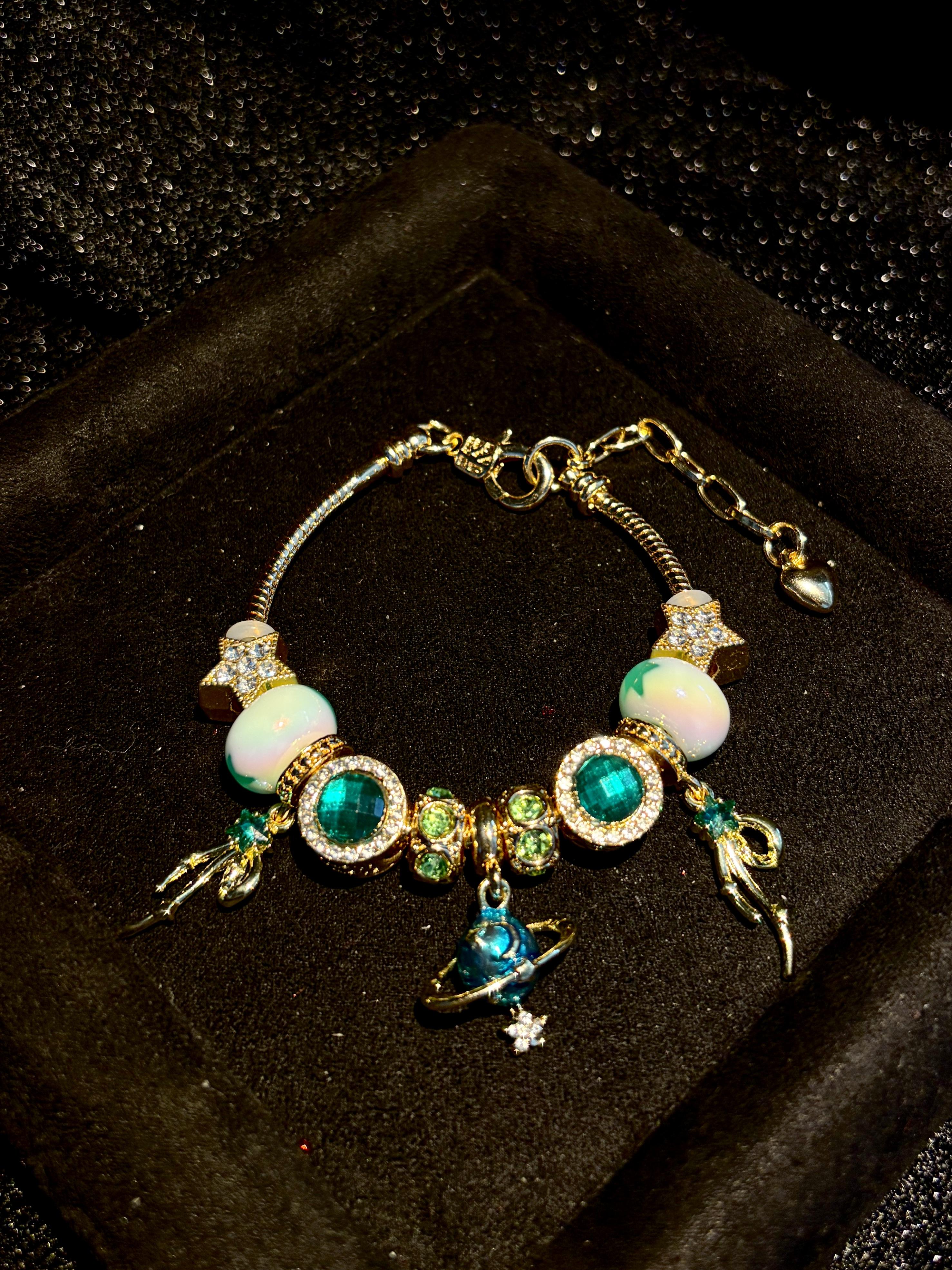Gold Tone Planet Charm Beaded Bracelet, Emerald Green Rhinestone Star Enamel Bead Snake Chain Bracelet, Adjustable Space Themed Jewelry Gift for Women Gold Tone Planet Charm Beaded Bracelet, Emerald Green Rhinestone Star Enamel Bead Snake Chain Bracelet, Adjustable Space Themed Jewelry Gift for Women