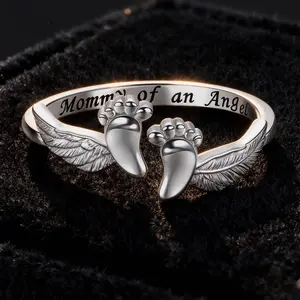 Angel Mother Ring: A loving keepsake gift adorned with baby footprints and angel wings. A Christmas gift for a child/mother.#christmasgiftideas  #gifts