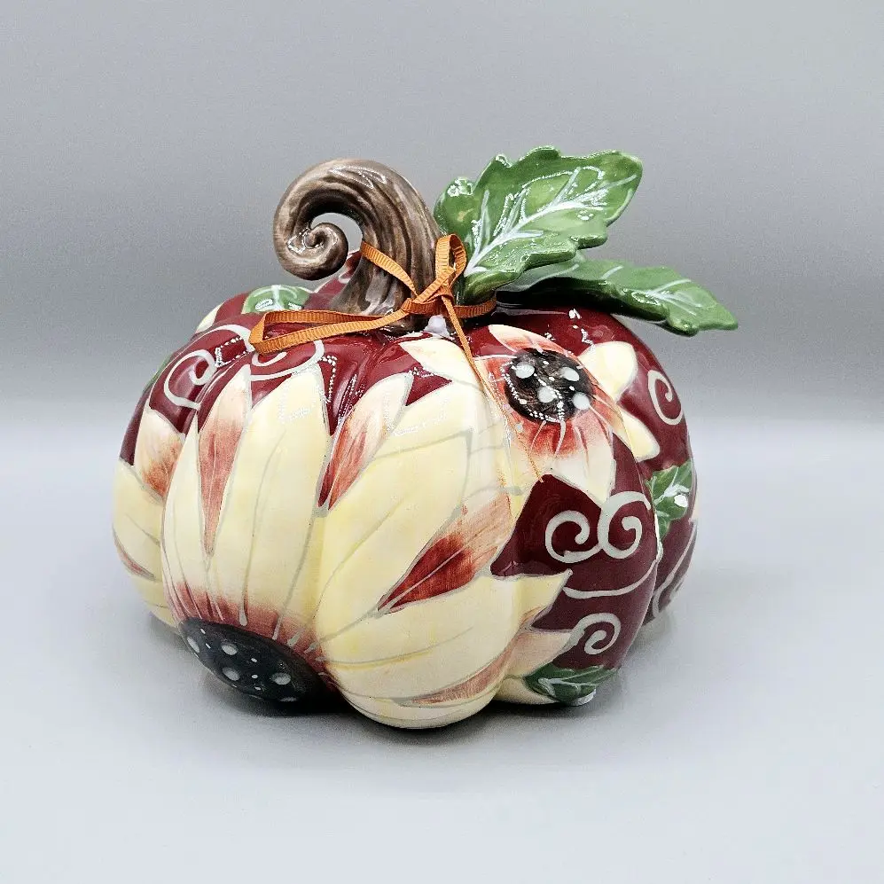 Blue Sky Clayworks Heather Goldminc Ceramic Pumpkin with Sunflower Petals Burgundy Accents Green Leaves & Happy Harvest Tag 5.5 Inches Tall