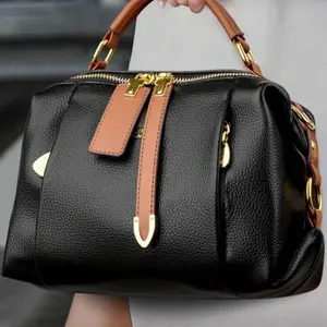 Elegant Black Leather Handbag with Gold Hardware and Brown Accents for Women