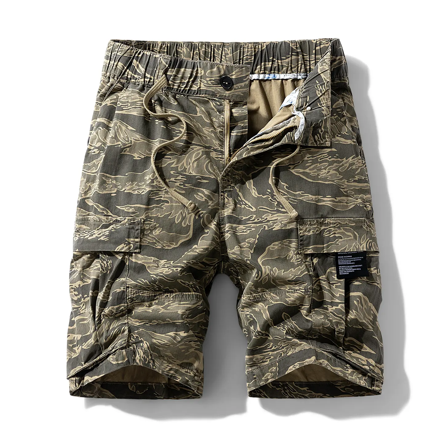 Classic tiger camouflage print with a retro military aesthetic, color palette with a distressed vintage look, trendy military style, high recognition factor, strong outfit vibe.