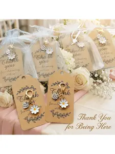 white daisy heart keychain set includes 10 keys + 10 thank-you cards + 10 organza bags. This DIY keychain, bag, and clasp set is the ideal appreciation gift or accessory for teachers, coaches, mentors, parents, and friends. It's an ideal pres