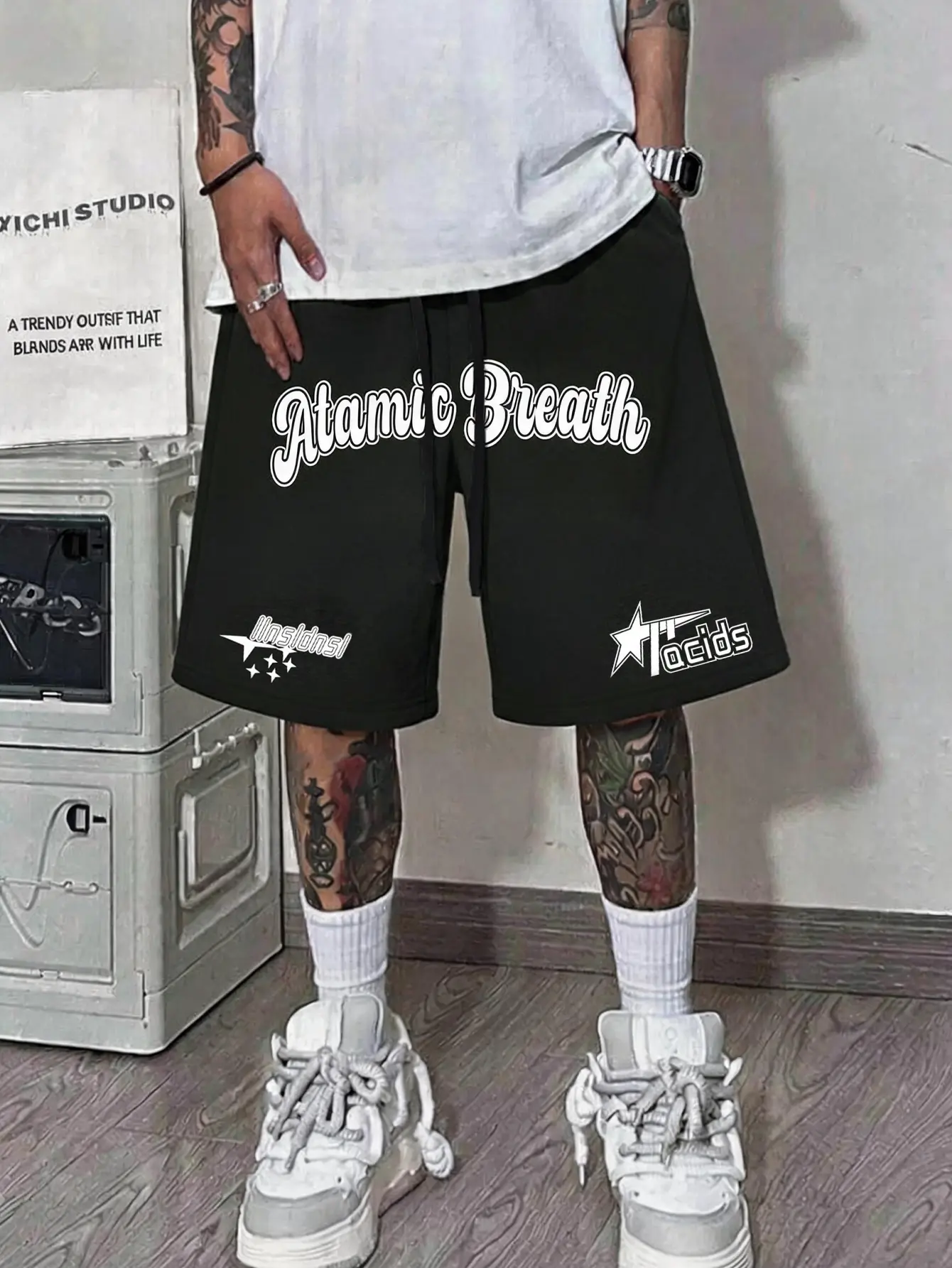 Men’s black casual knit shorts with multiple logo prints — elastic waistband with adjustable drawstring, wide-leg Bermuda sweat shorts with breathable fabric and star/English pattern details; sporty mid-length shorts in West Coast street style, trendy and