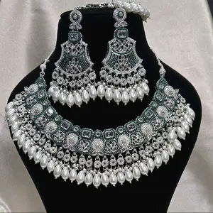 Pakistani Style Polki AD Set with Earrings and Maang Tikka Featuring Intricate Design and Pearl Accents